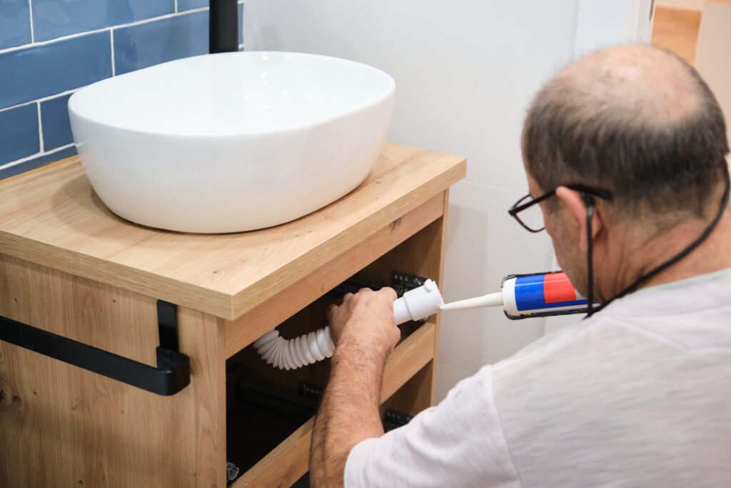 harrington man working on bathroom sink plumbing installation 2026 03 20 02 20 37 utc
